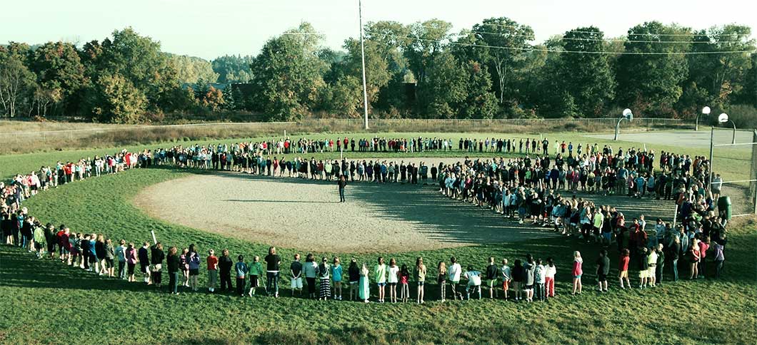 Central Woodlands students and staff forming a peace sign