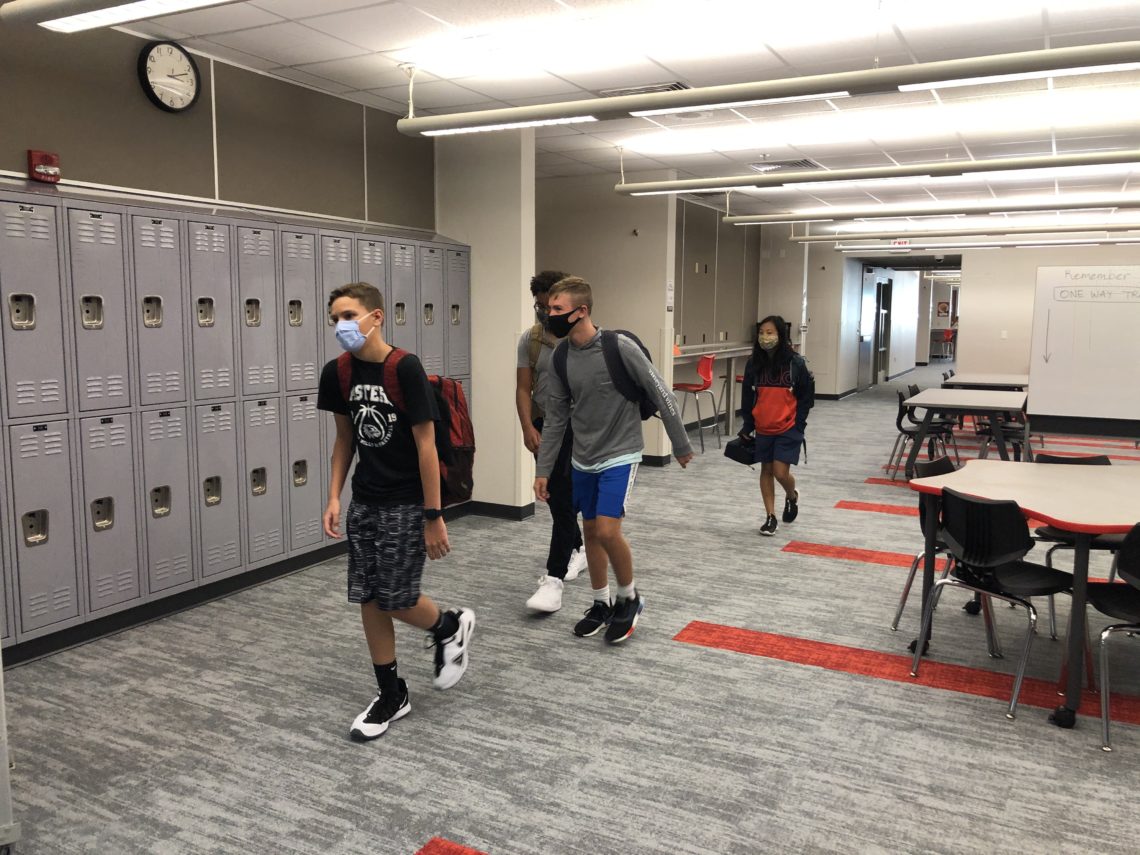 photo of students passing new lockers at EMS