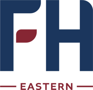 simplified red leaf logo for Eastern attendance area of Forest Hills Public Schools
