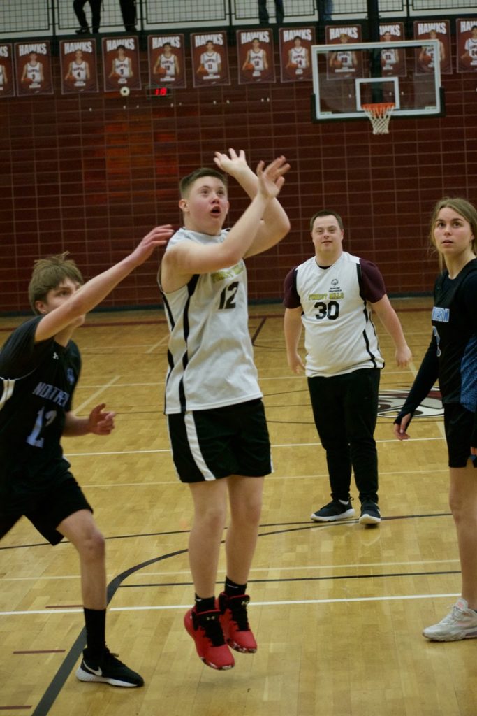 NHS student shooting basketball