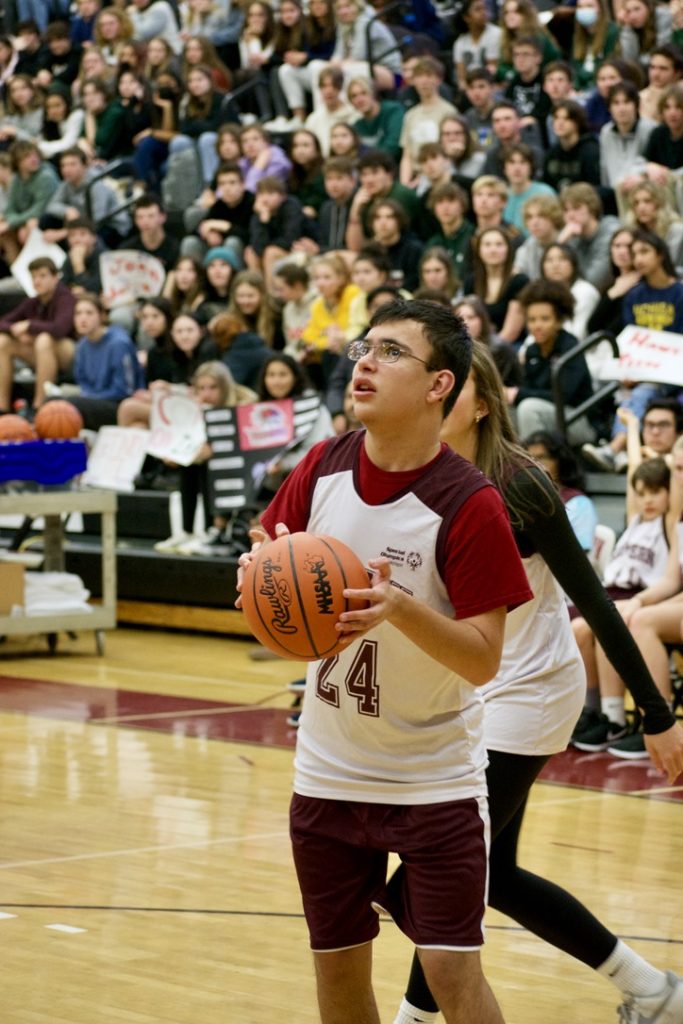 FHE Student playing basketball