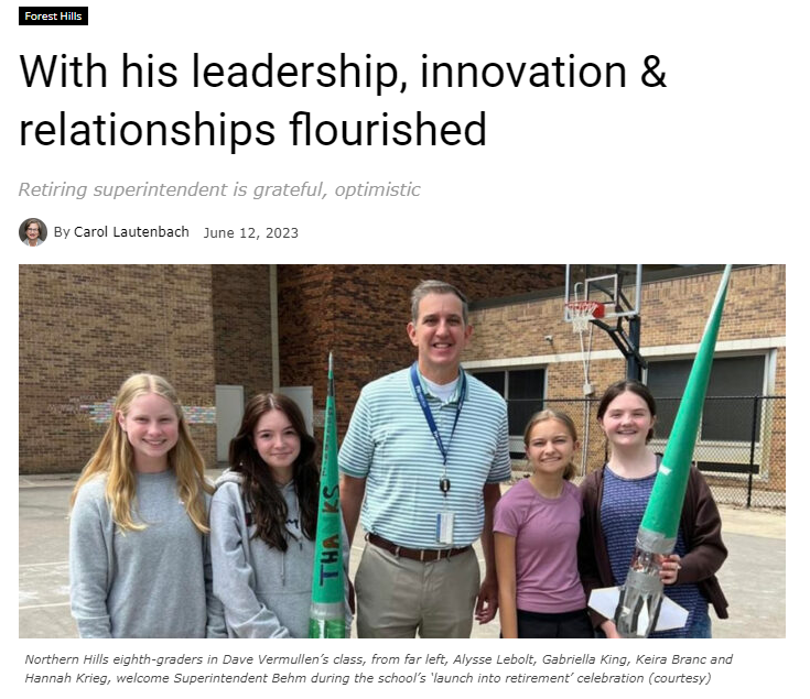 With his leadership, innovation & relationships flourished school news network article with a man next to students holding rockets