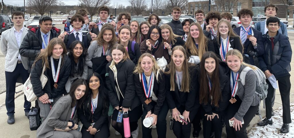 EHS DECA Students posing for pic outside GVSU