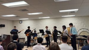 a small jazz ensemble play instrument