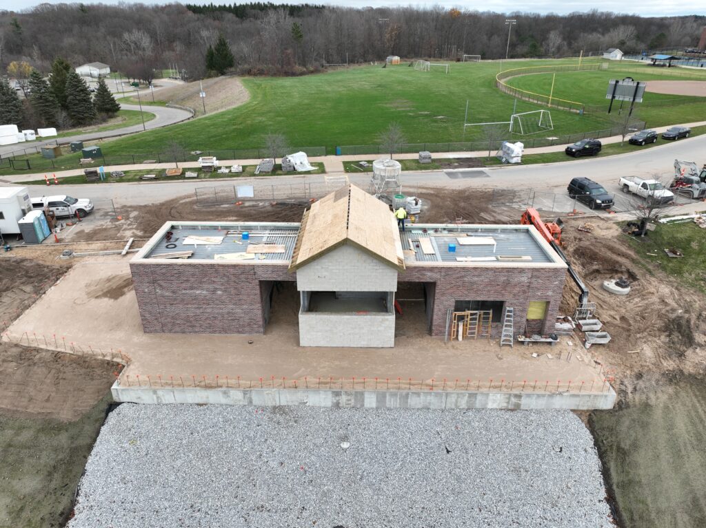 drone shot of an entrance and gate to the auxiliary field