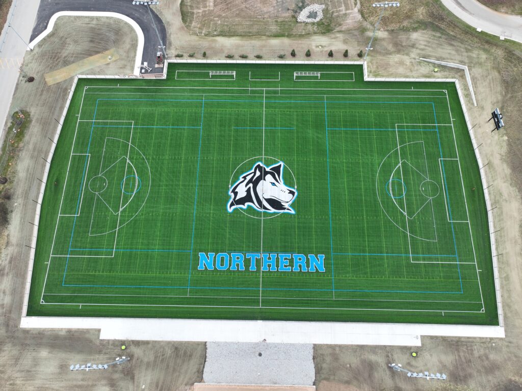drone shot of the field with the northern husky in the center