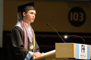 a high school graduate at a podium