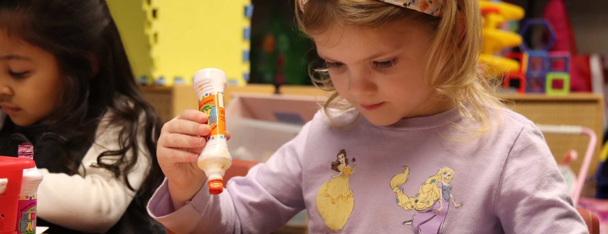 young students working on a craft in class