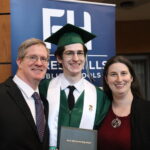 two parents with a graduate