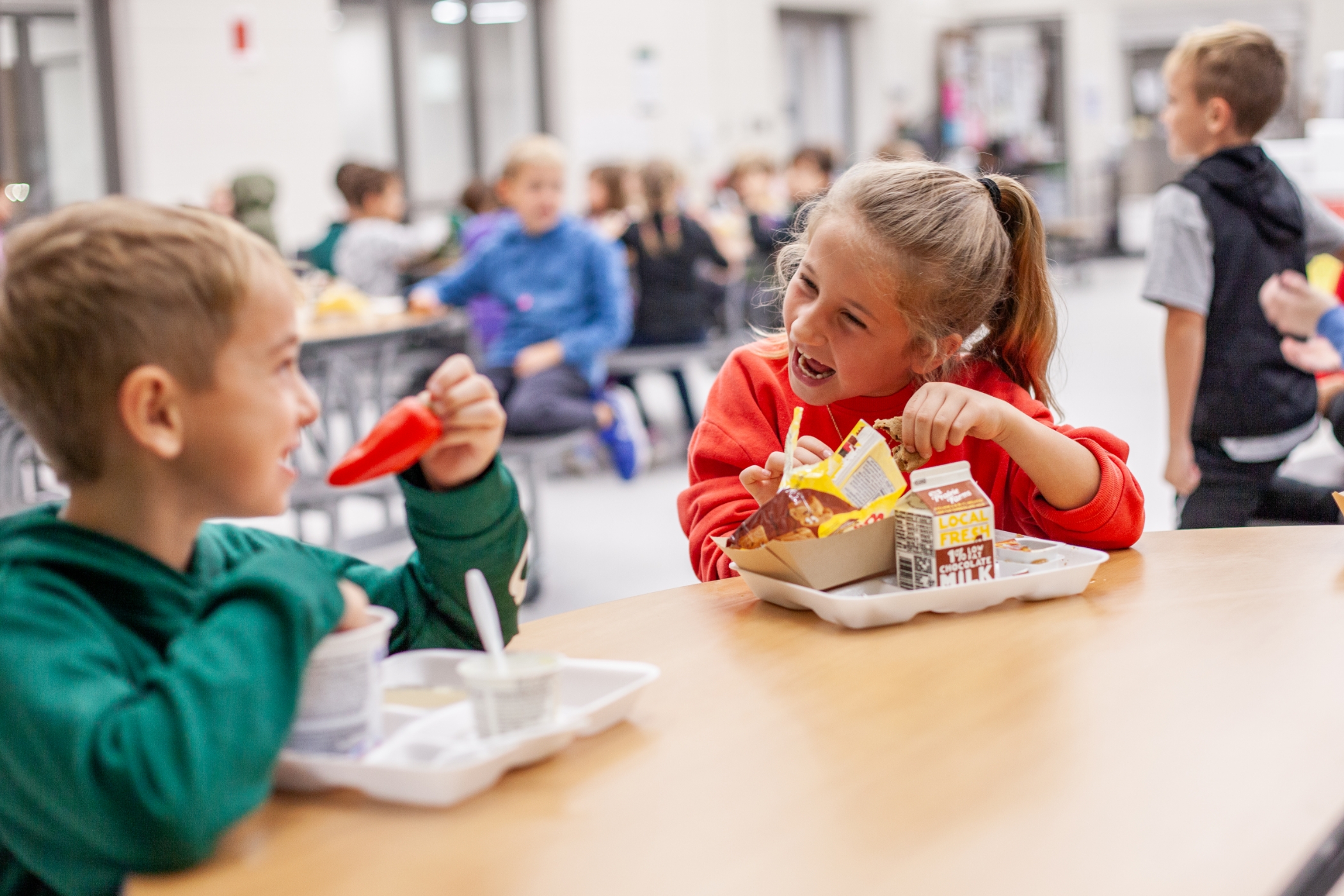 students eating lunch in the cafeteria