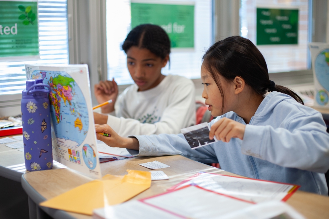 students looking at a map in class