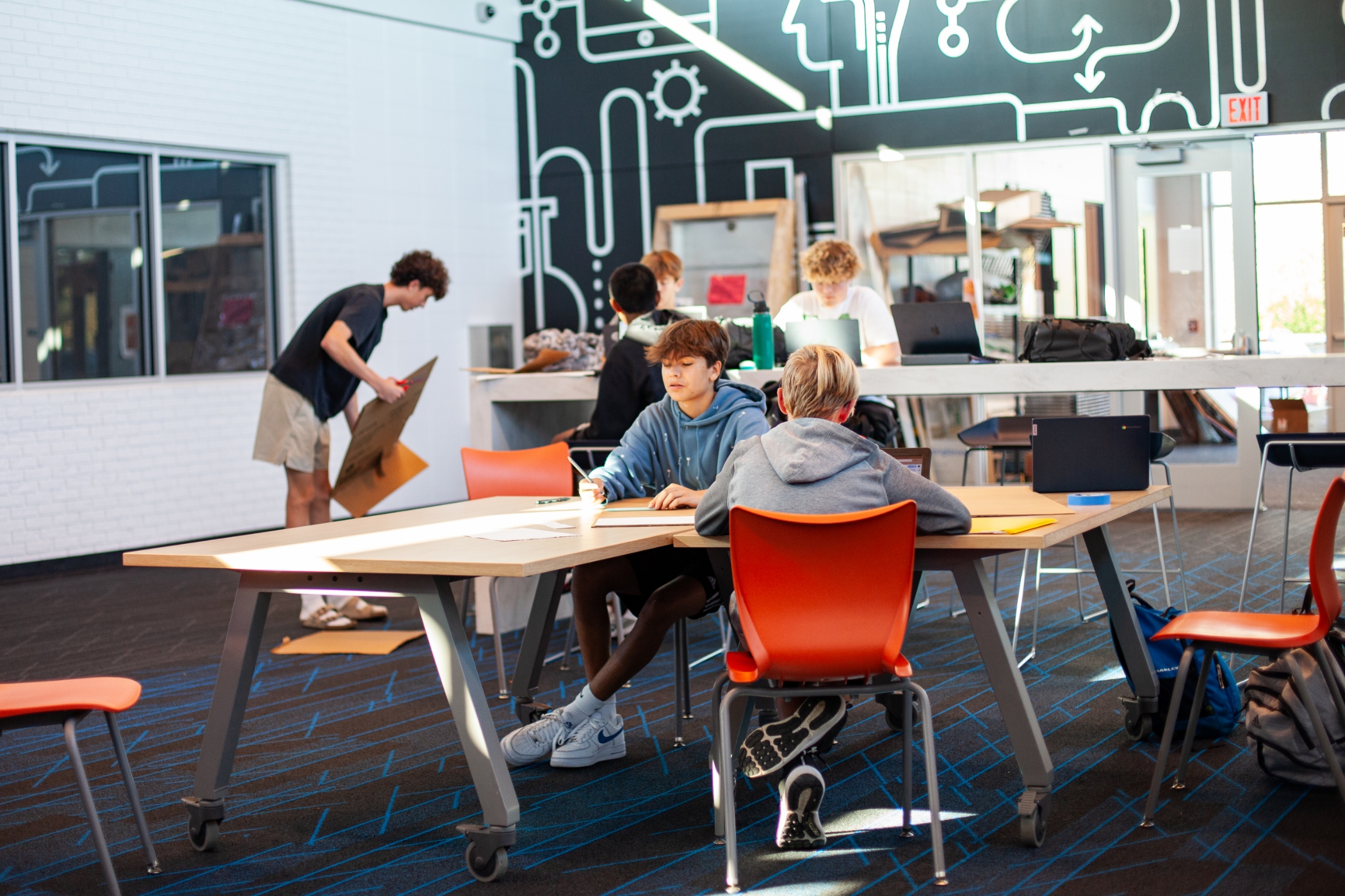 male students working at desk