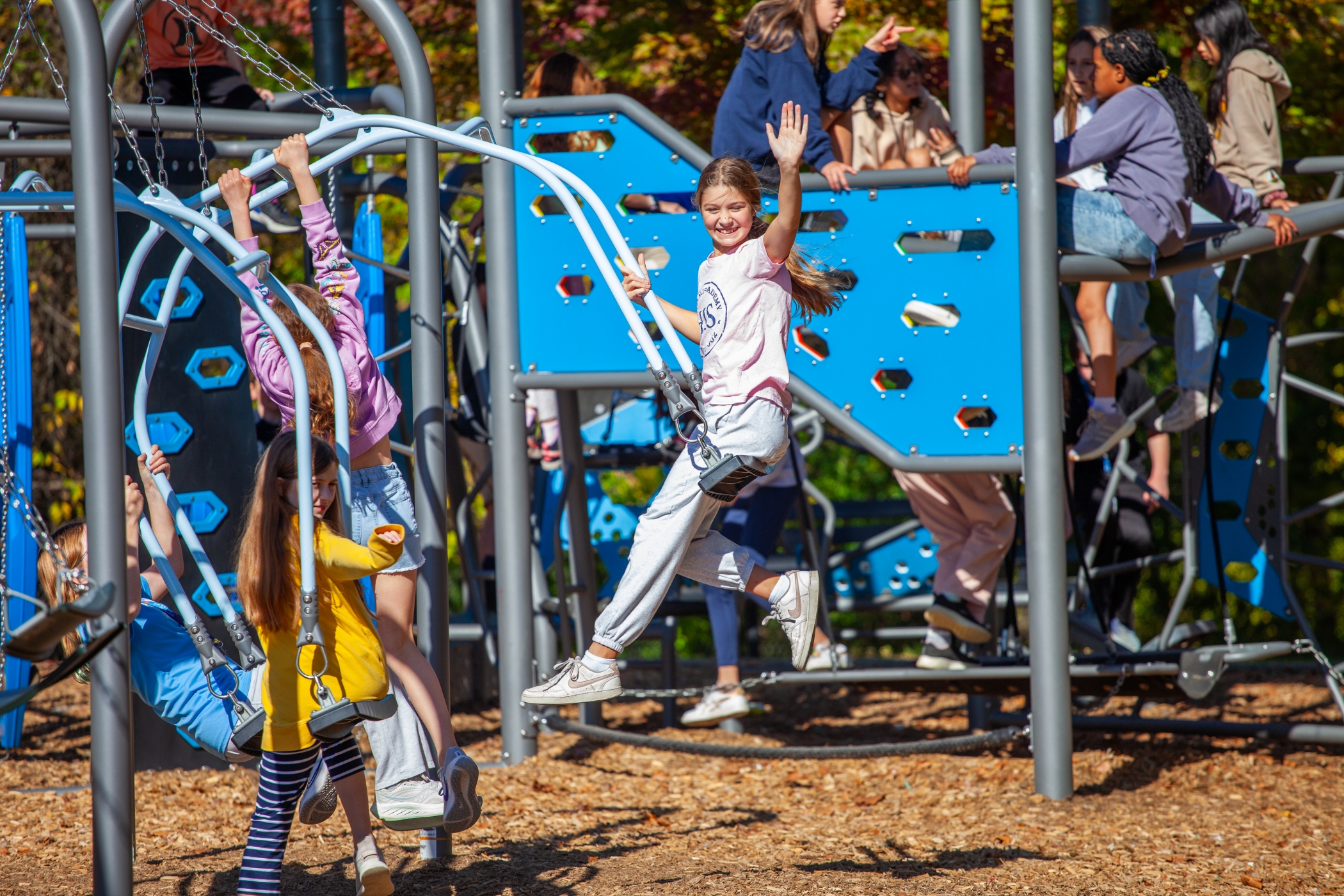 a bunch of students playing on playground
