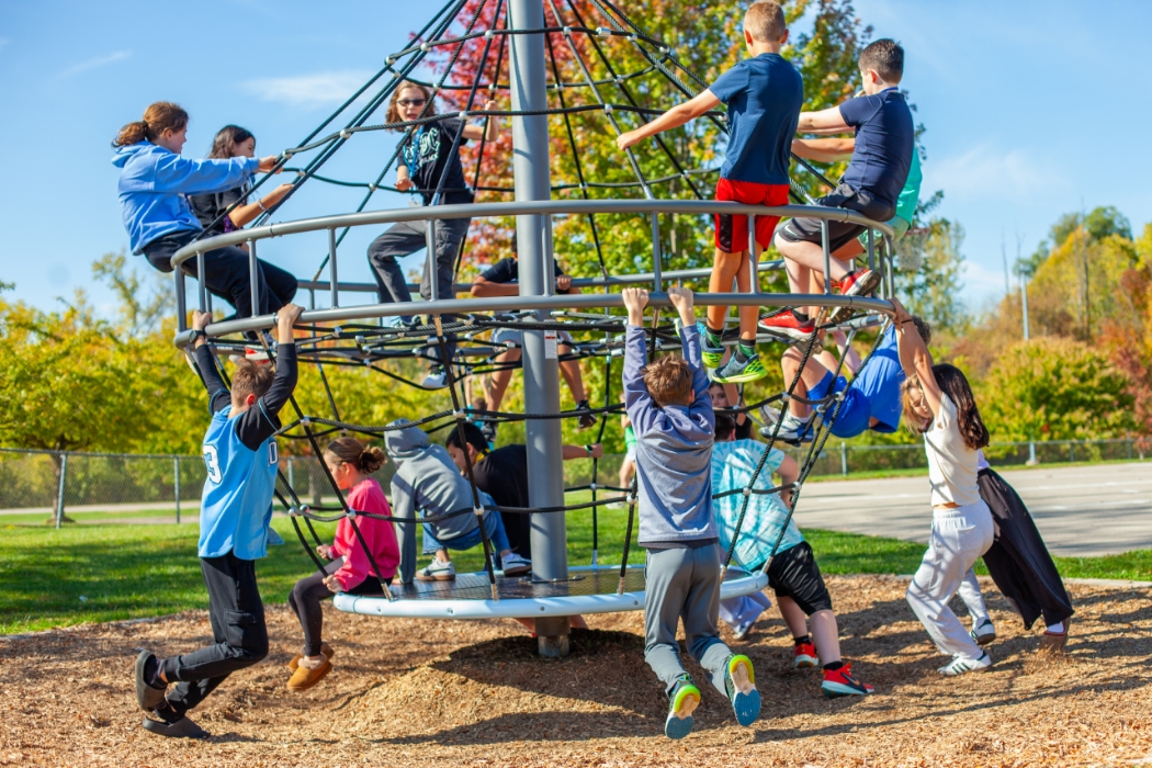students playing on a jungle gym
