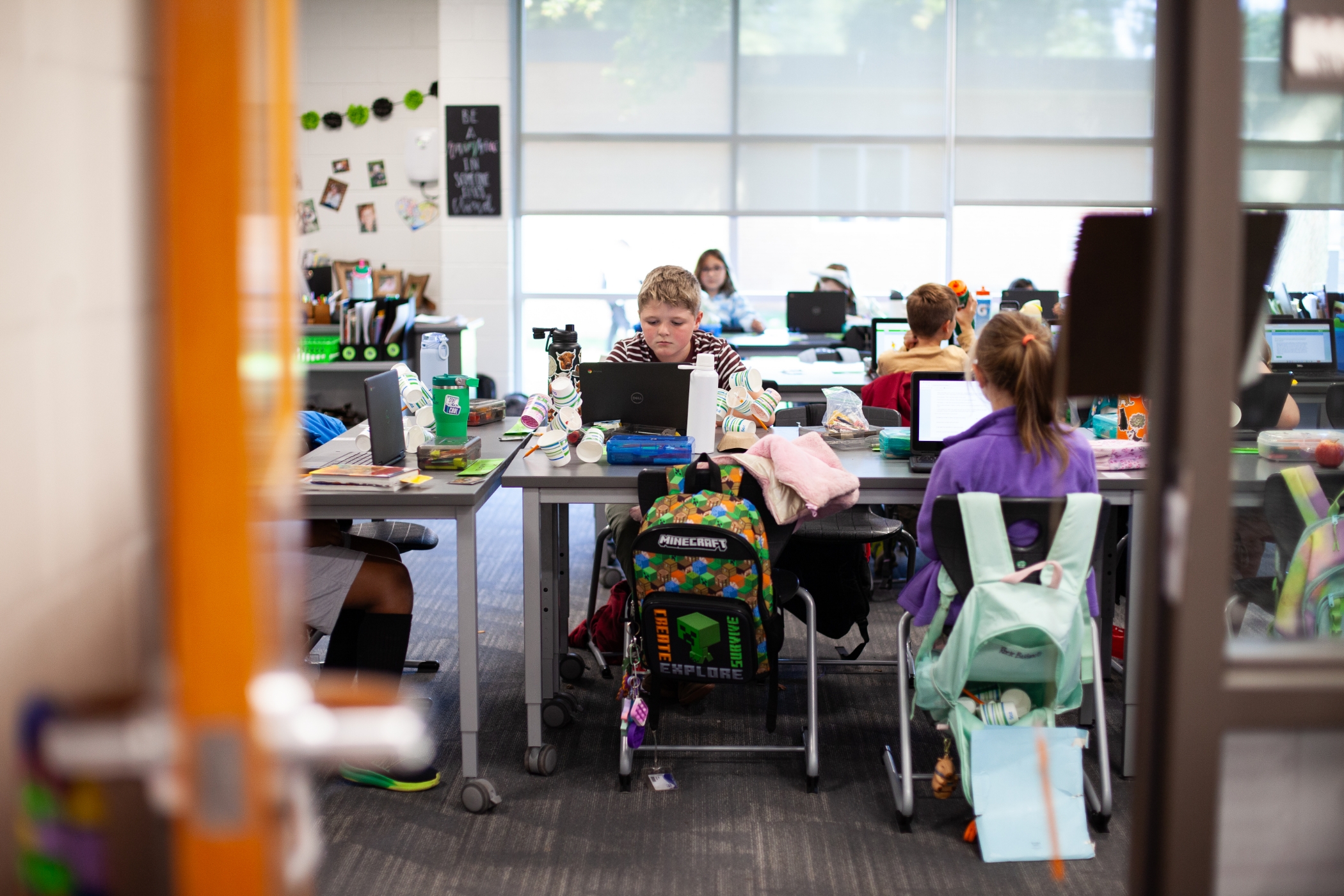 students doing work on their computers