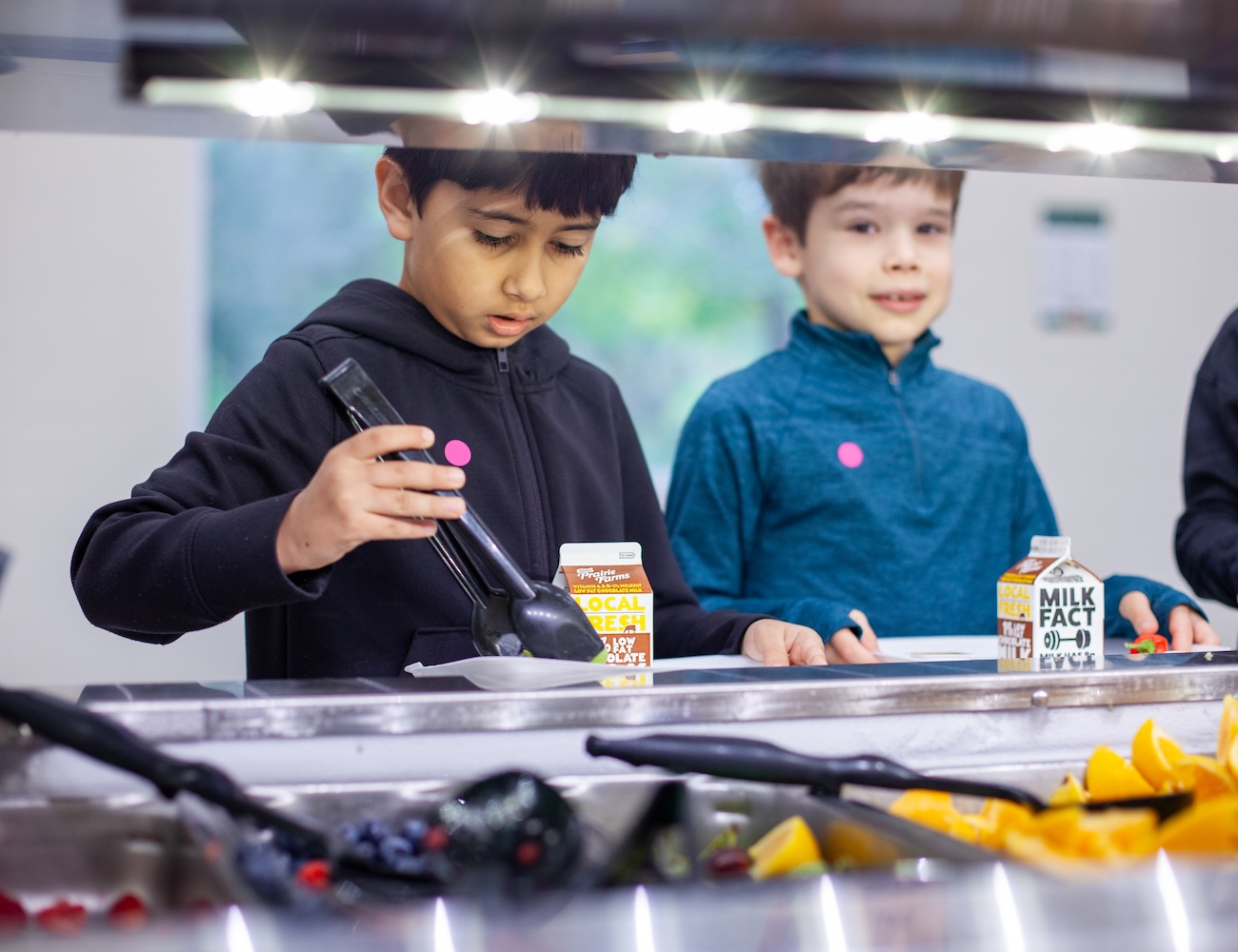 two young boys getting lunch