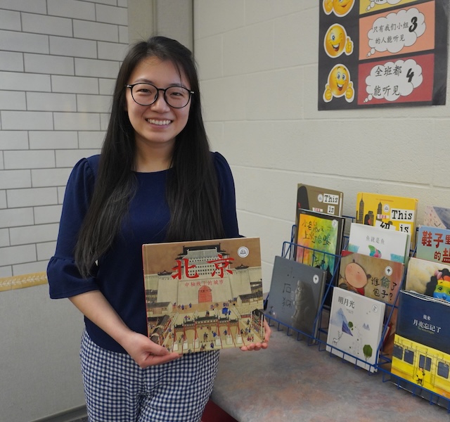 mandarin immersion teacher showing her class books