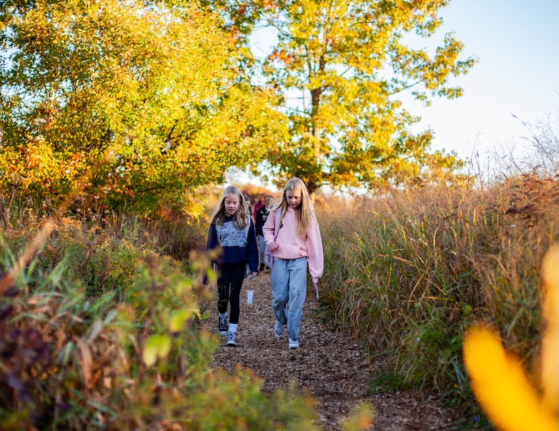 students walking down a trail