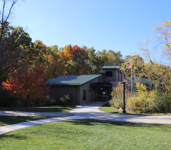 photo of building with trees and grass