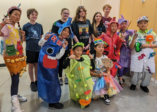 a group of students in a variety of different costumes