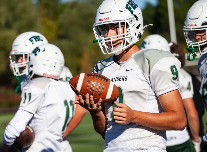 football player holding a football