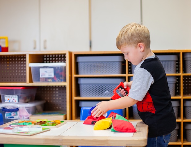 young student working on fine motor skills