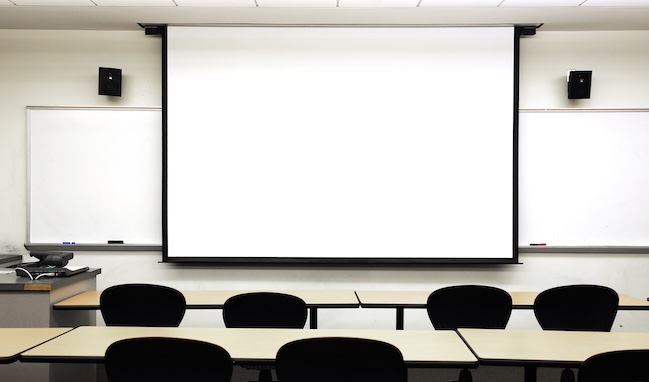 empty classroom with white projector screen