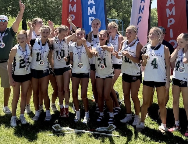girl's team celebrating their win with medals