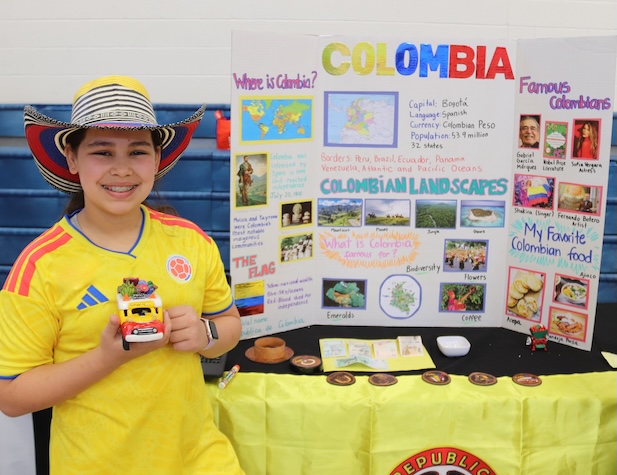 young female student showing off her presentation about Columbia