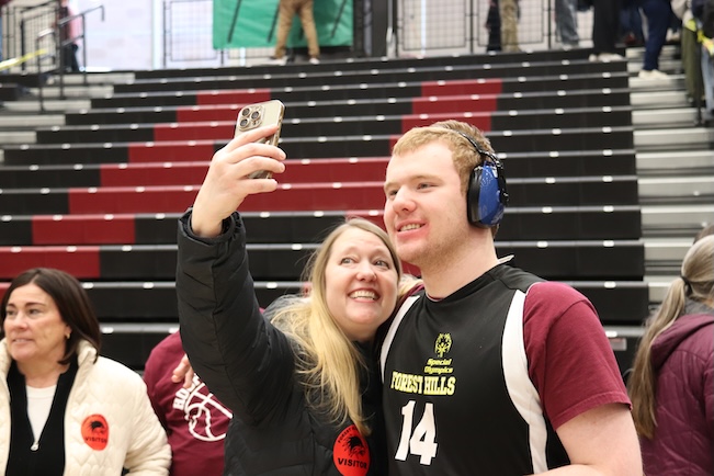 parent taking a selfie with their student