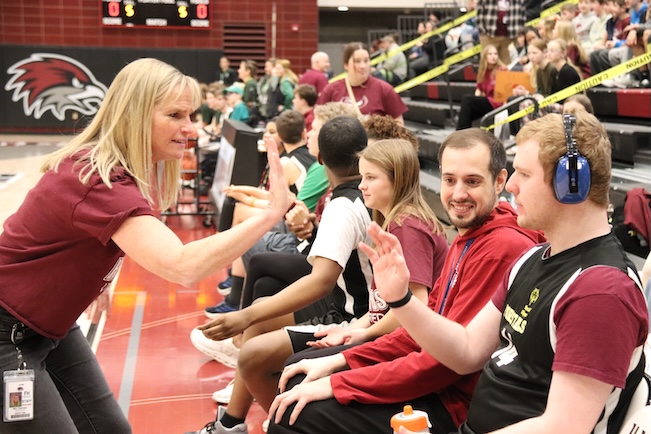 teacher highfiving student