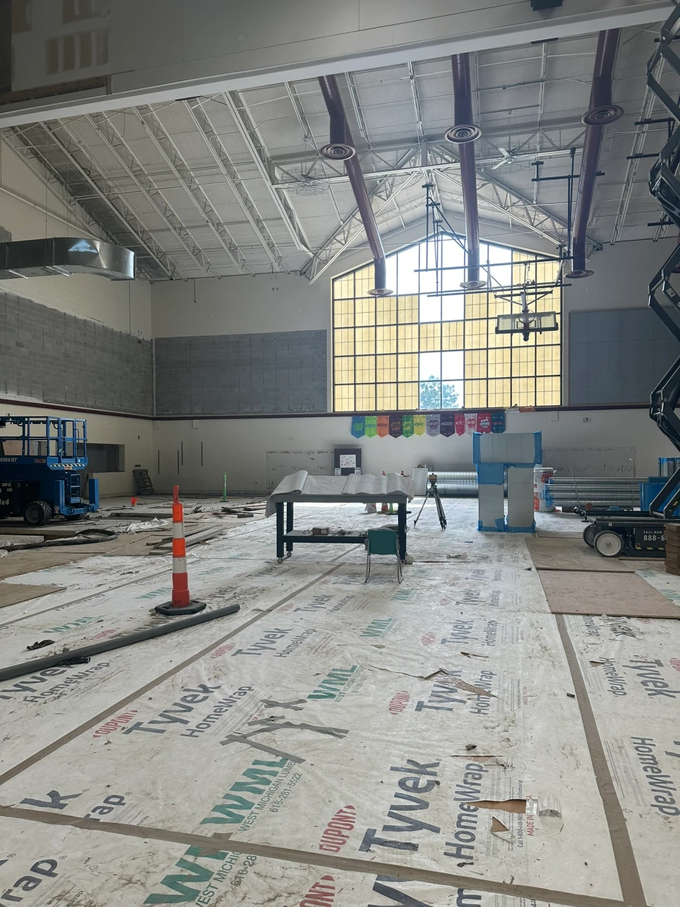 Construction progress inside with heavy machinery at work