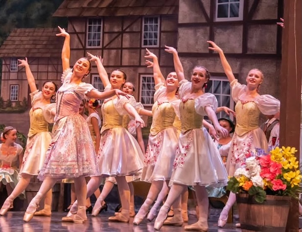 women in ballet performing on a stage