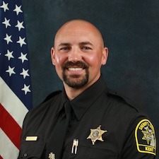 Man in KCSO uniform smiling
